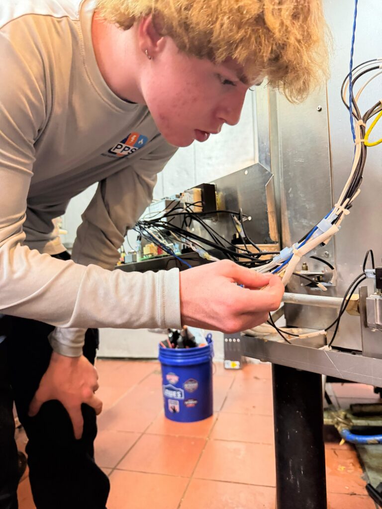 Inside the gas convection oven — burner tray and igniter assembly area
