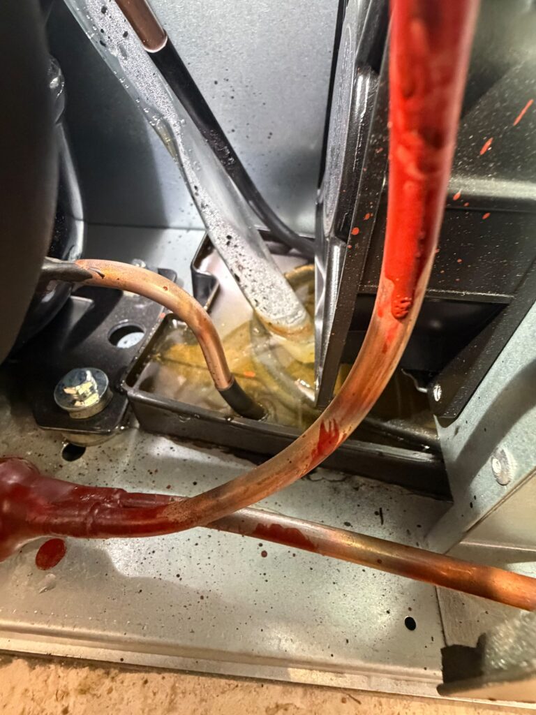 Refrigerant lines and connections inspected as part of the full system check.