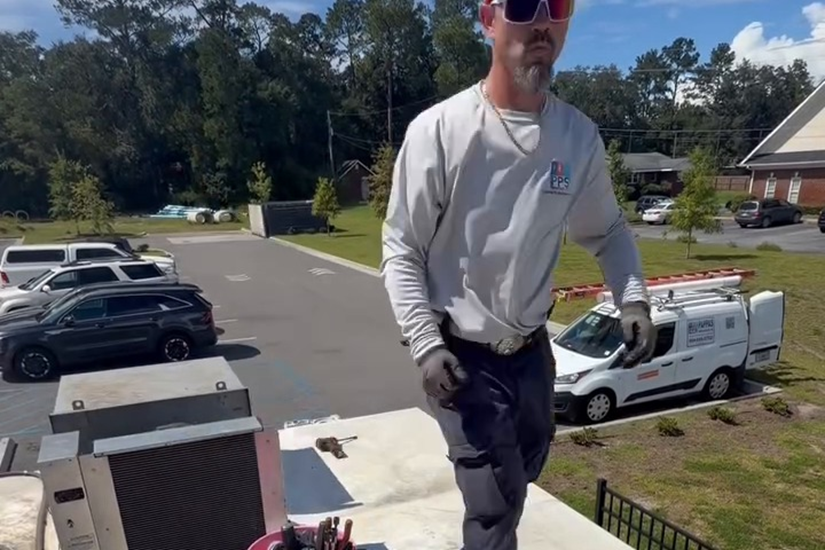 A Pappas Parts & Service technician on a commercial rooftop service call in Northeast Florida.