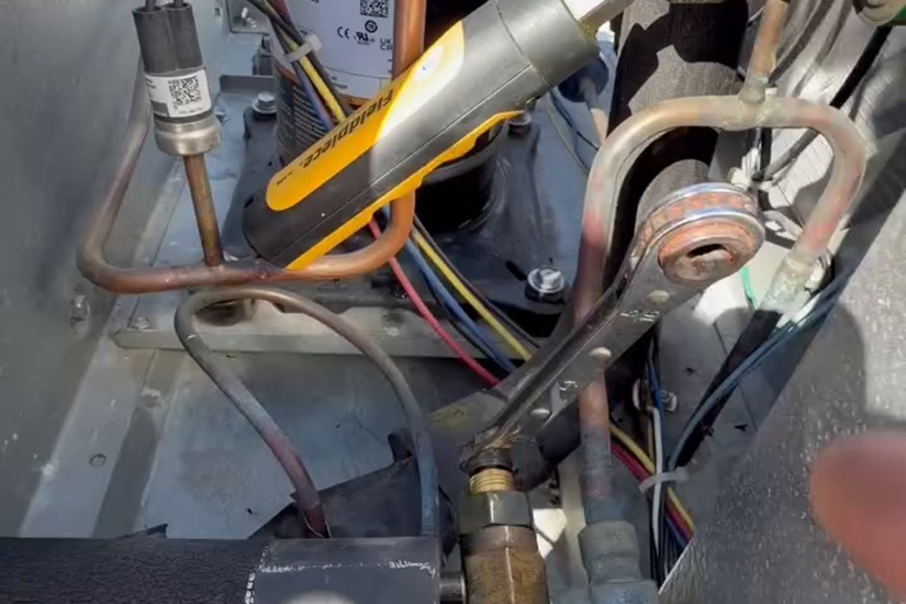 A careful TXV adjustment, not a new system, solved the freeze-up.