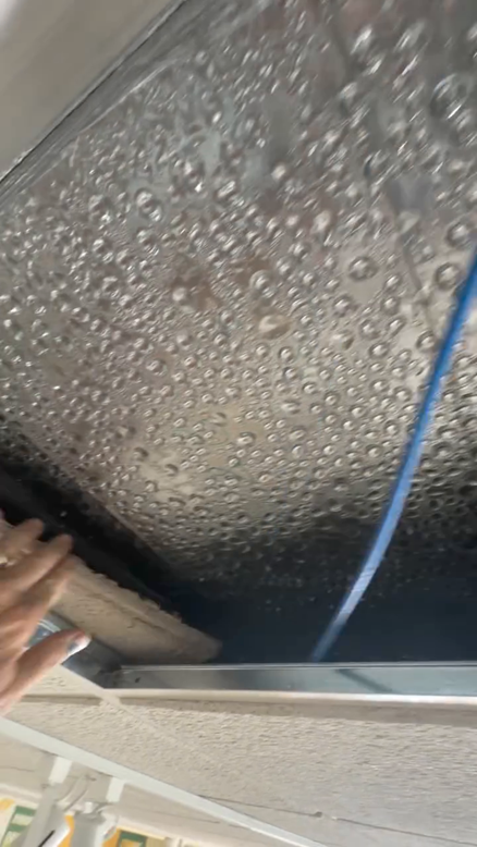 Heavy condensation beading across an uninsulated duct — a classic cause of ceiling dripping water.