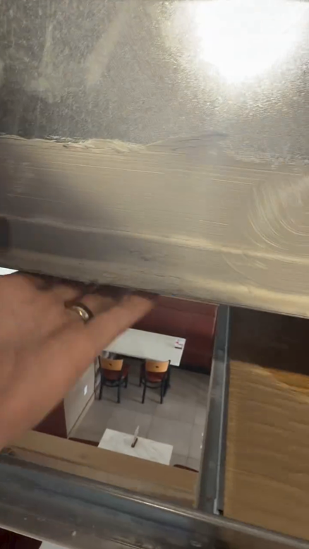 The dining booth directly below the leaking duct section.