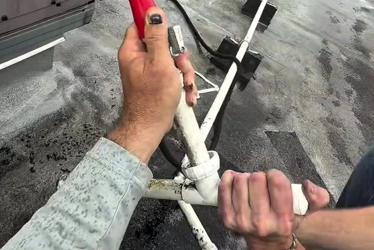 Flushing and clearing the condensate drain is a routine part of professional rooftop service.