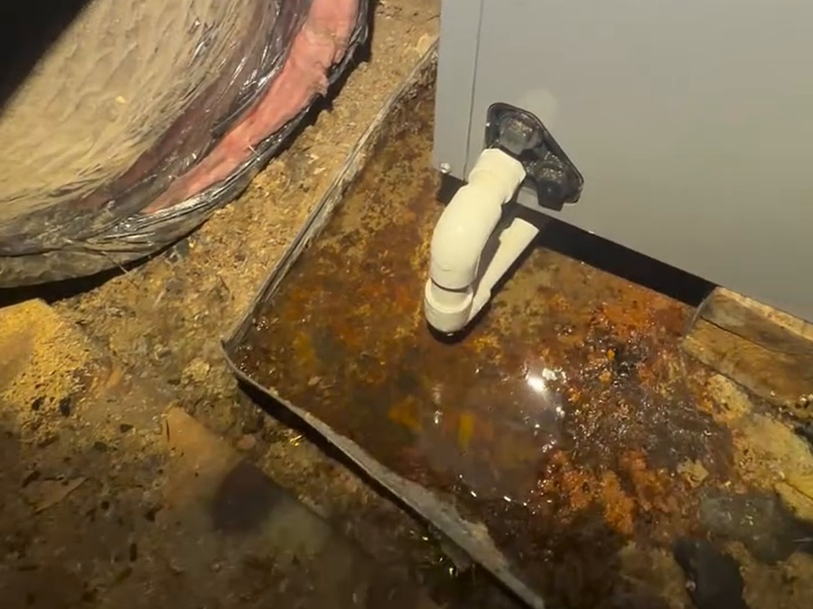 Rust and moisture staining around the air handler is another red flag we noticed on this inspection.