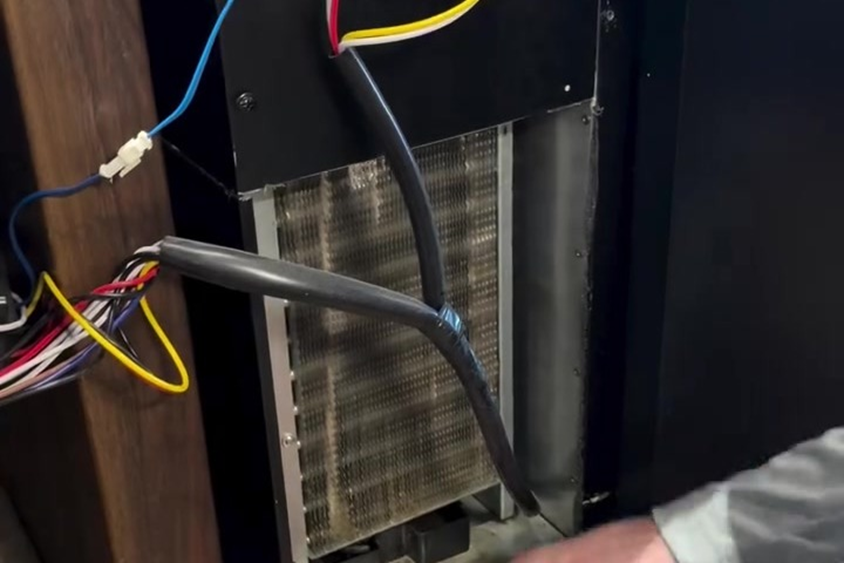 Step 2 wiring and the condenser coil are inspected for damage, dirt and loose connections.