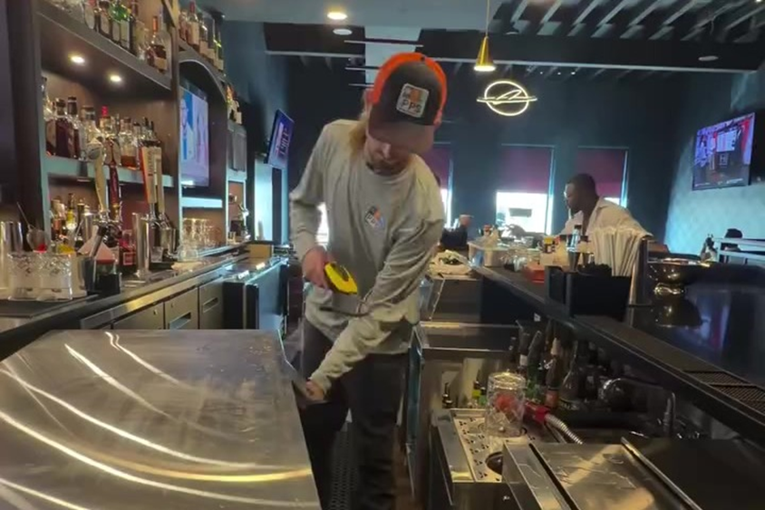 Step 5 final checks behind the bar before the cooler goes back into service.