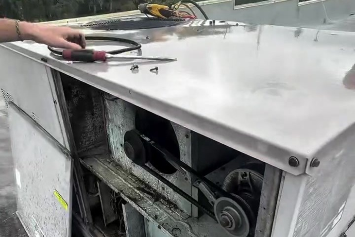 The blower compartment holds the motor, pulleys, and belt that move air through the system.